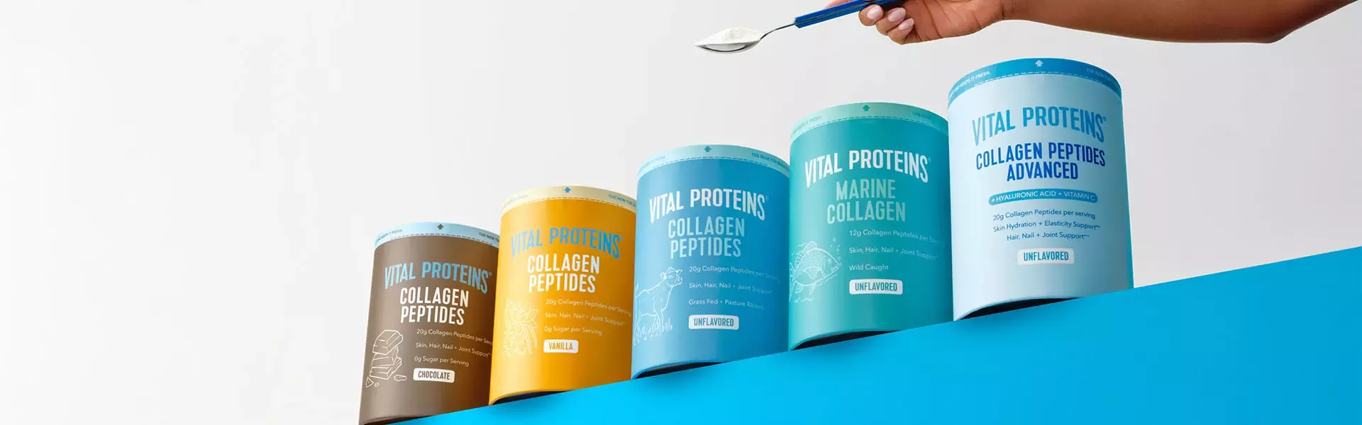 Vital Proteins collagen supplement tubs displayed with a spoonful of powder above.